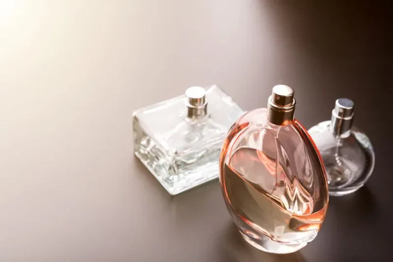 Various perfume bottles displaying the essence of luxury perfume ingredients in elegant glass containers.