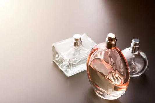Various perfume bottles displaying the essence of luxury perfume ingredients in elegant glass containers.