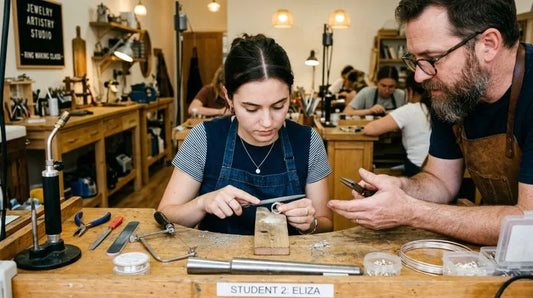 Student creating a custom ring with a jeweler during an Irvine ring making workshop using professional tools.